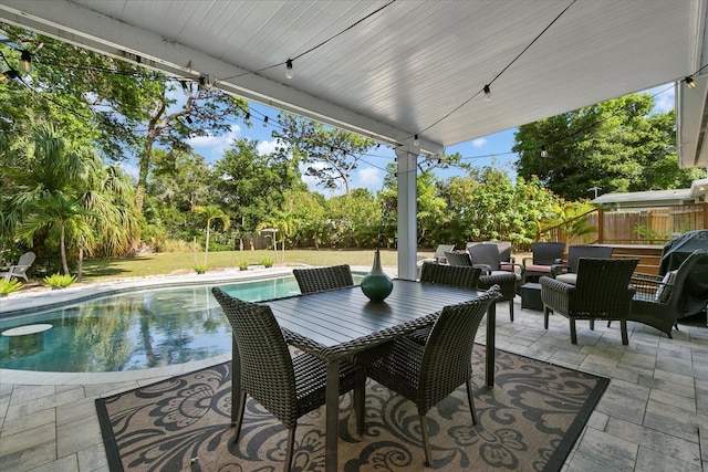 1101 N Betty Ln, Clearwater, FL 33755 - fenced backyard featuring a patio, an outdoor pool, outdoor lounge area, and view of scattered trees