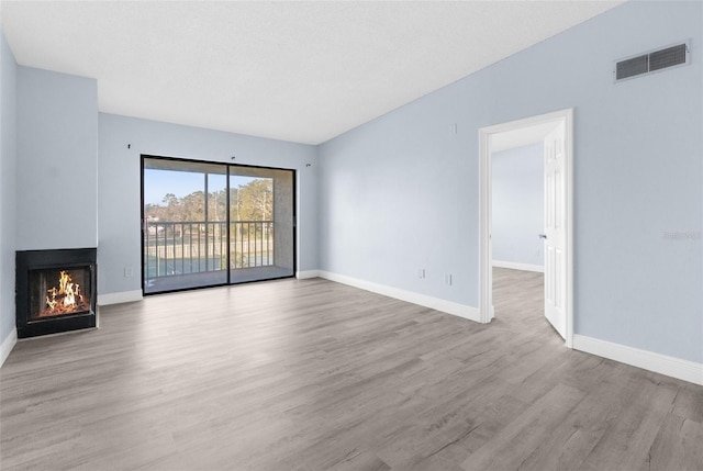 unfurnished living room with light wood-type flooring