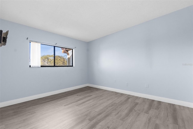 empty room with light wood-type flooring