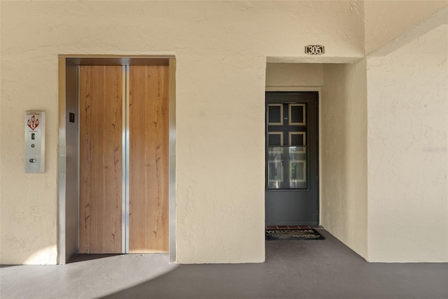 view of exterior entry featuring elevator