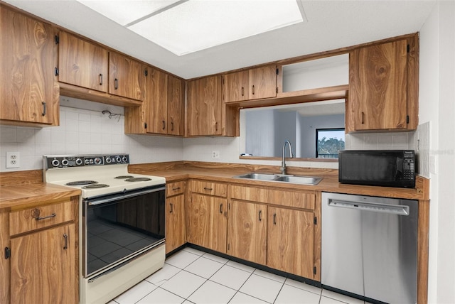 kitchen featuring sink, light tile patterned floors, white range with electric cooktop, tasteful backsplash, and stainless steel dishwasher