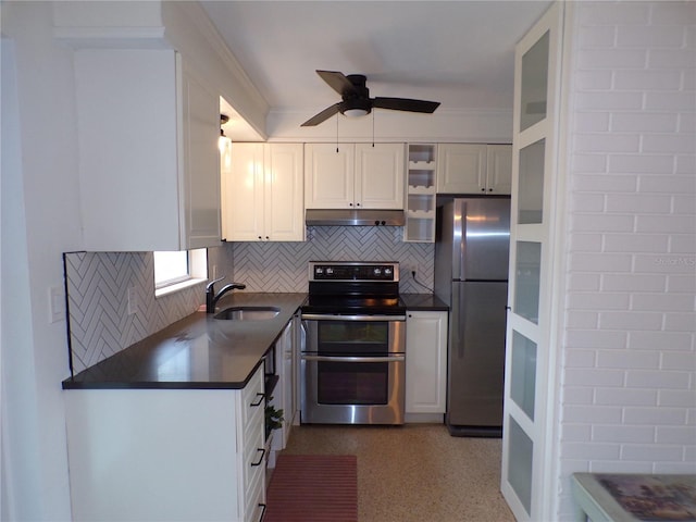 kitchen featuring tasteful backsplash, appliances with stainless steel finishes, sink, and white cabinets