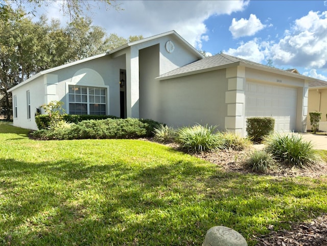 view of home's exterior featuring stucco siding, an attached garage, driveway, and a yard