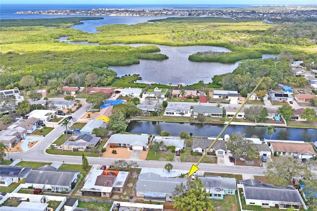 bird's eye view featuring a water view and a residential view