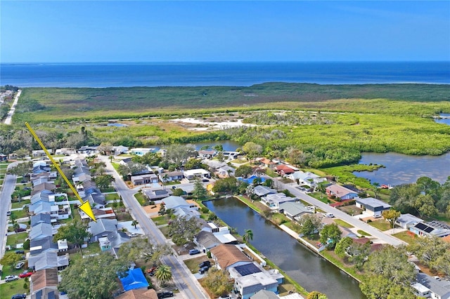 birds eye view of property featuring a residential view and a water view