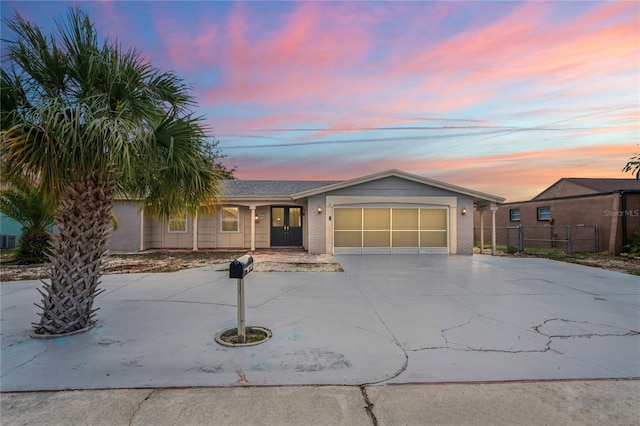 single story home featuring a garage