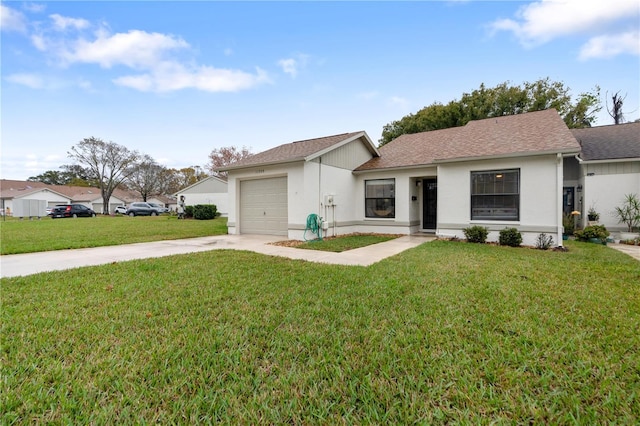 ranch-style home featuring driveway, stucco siding, an attached garage, and a front yard