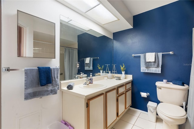 bathroom featuring toilet, a shower with curtain, tile patterned flooring, and vanity