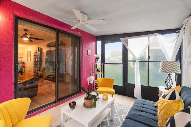 sunroom / solarium with a ceiling fan