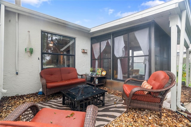 view of patio / terrace with an outdoor fire pit