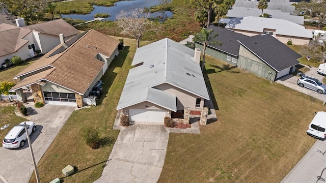 drone / aerial view with a water view