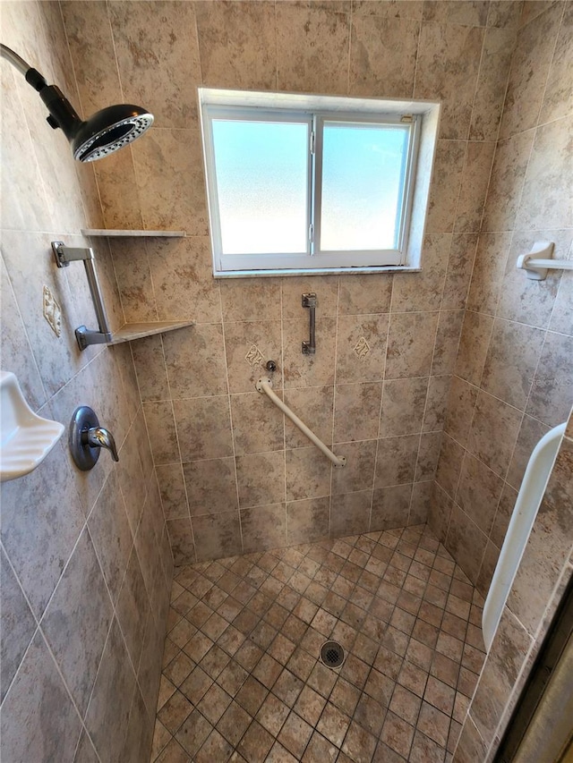 full bathroom with tiled shower