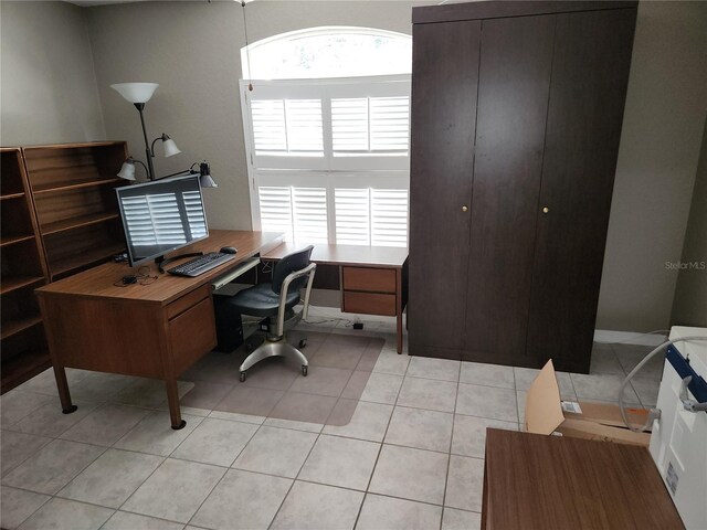 office area featuring light tile patterned flooring