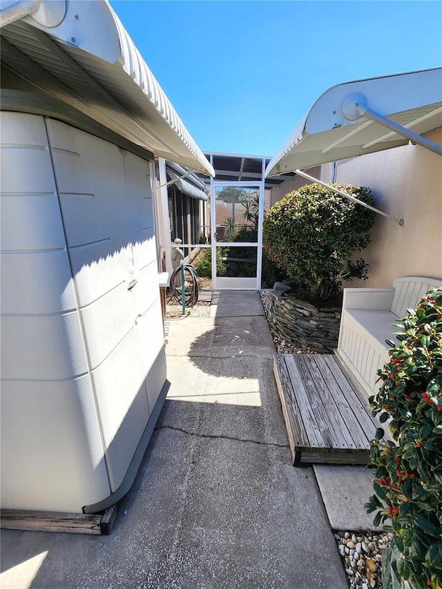 view of patio / terrace featuring a sunroom