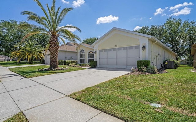 single story home featuring central AC, a garage, and a front lawn