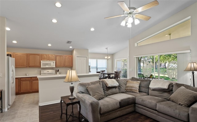 living room with vaulted ceiling and ceiling fan