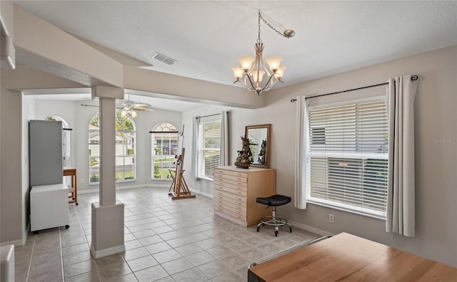 office area with light tile patterned floors and ceiling fan with notable chandelier