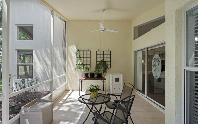 sunroom / solarium with ceiling fan