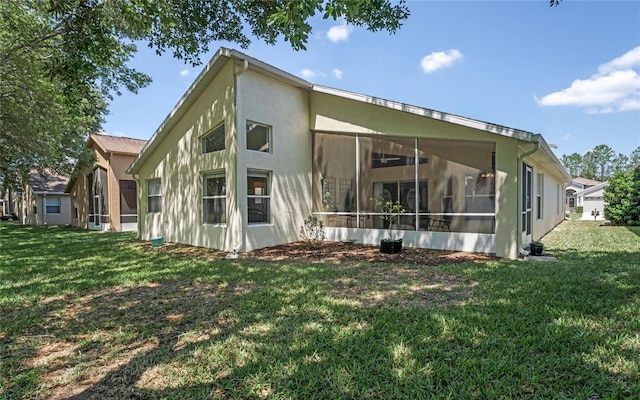 rear view of property featuring a yard