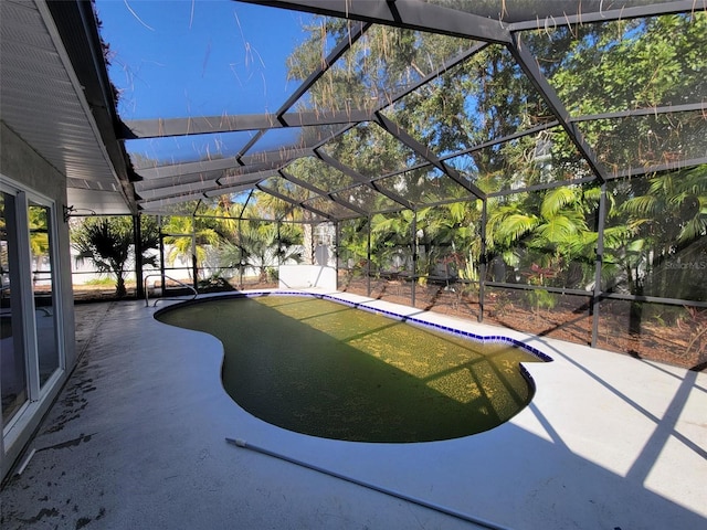 view of pool featuring a patio and a lanai