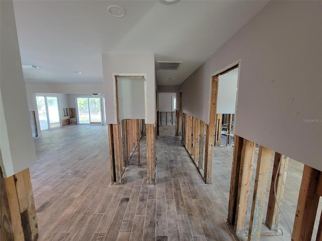 corridor featuring wood-type flooring