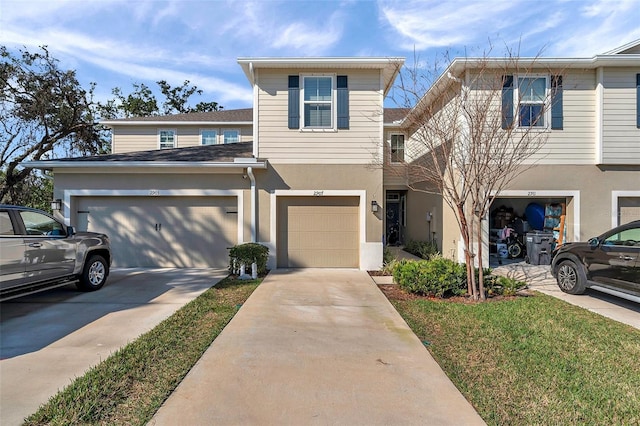 view of front facade with a garage and a front yard