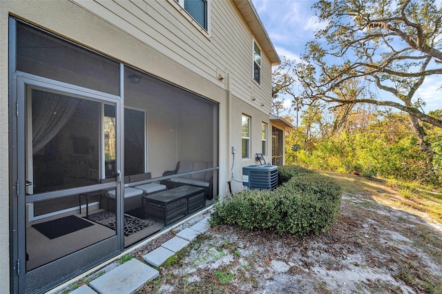 view of side of property with central AC unit