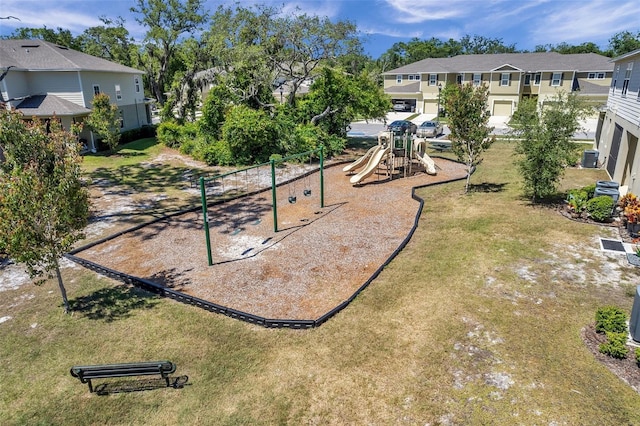 view of playground with a lawn