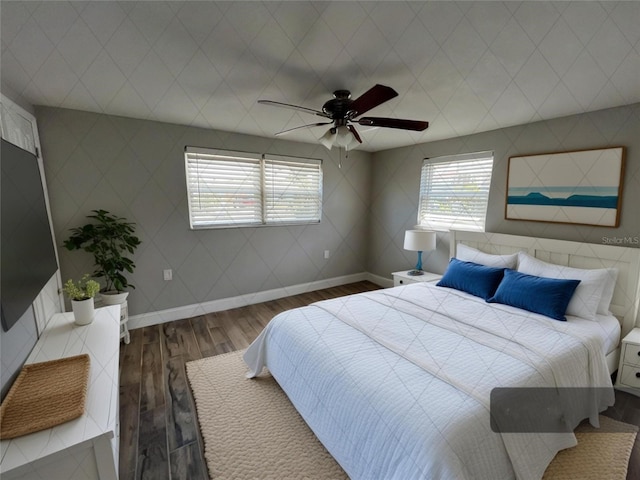 bedroom featuring dark hardwood / wood-style flooring and ceiling fan