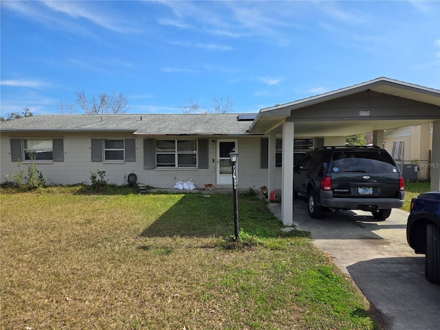 single story home with a front yard and a carport