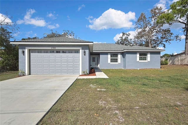 single story home with a garage and a front lawn