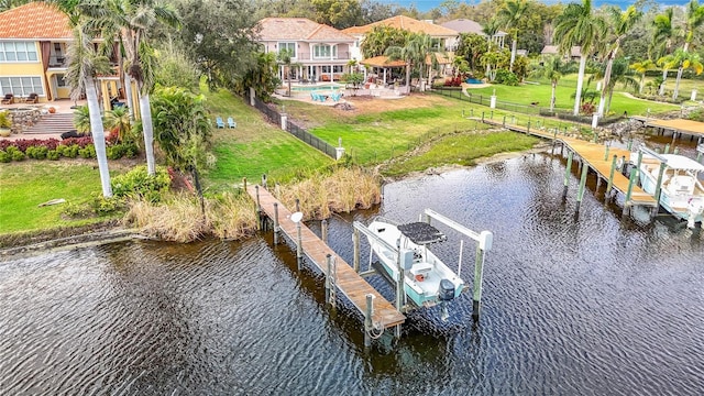 bird's eye view featuring a water view and a residential view