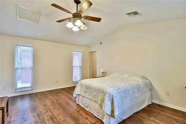 bedroom with lofted ceiling, hardwood / wood-style floors, and ceiling fan