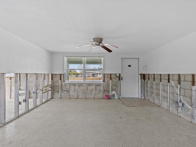 interior space featuring ceiling fan