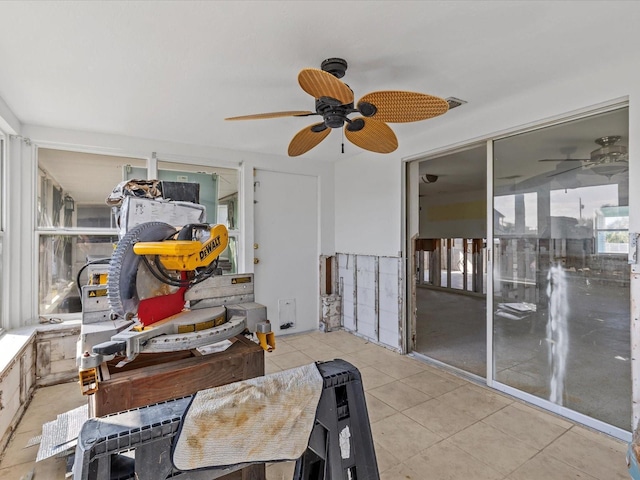 interior space featuring ceiling fan