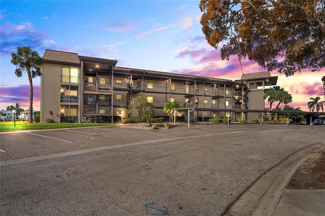 view of outdoor building at dusk