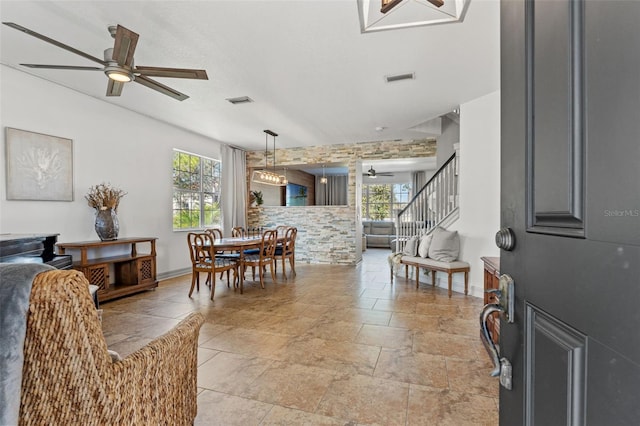 dining area with a wealth of natural light and ceiling fan