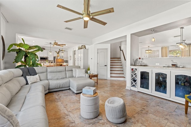 living room with ceiling fan