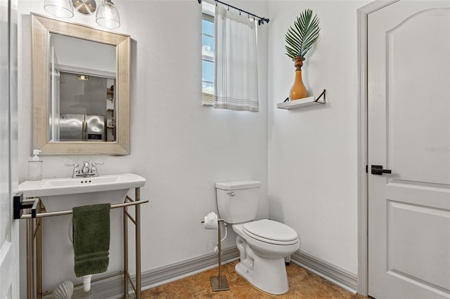 bathroom featuring tile patterned floors and toilet