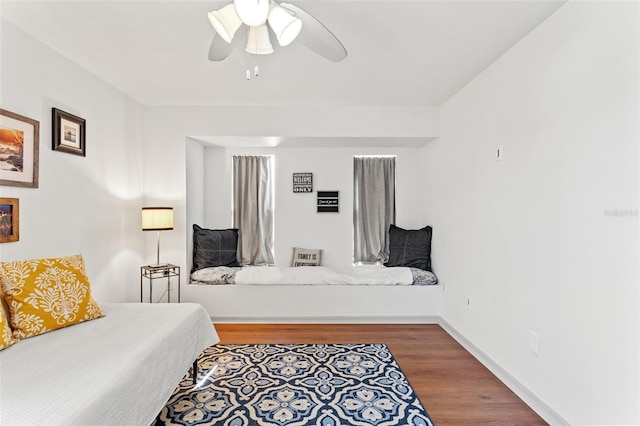 bedroom with hardwood / wood-style flooring and ceiling fan