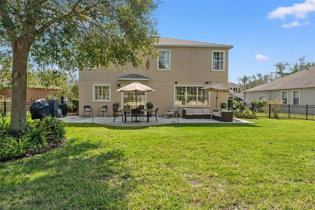 rear view of property featuring an outdoor living space, a lawn, and a patio