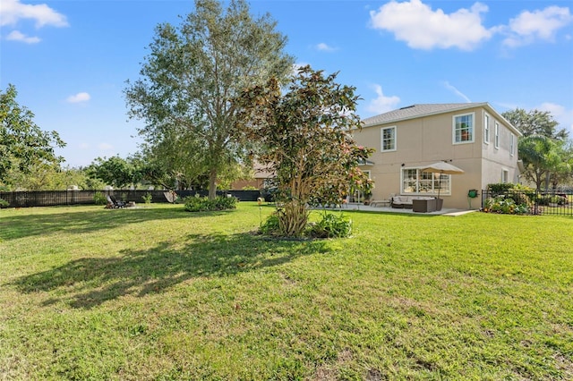 view of yard with central AC and a patio area