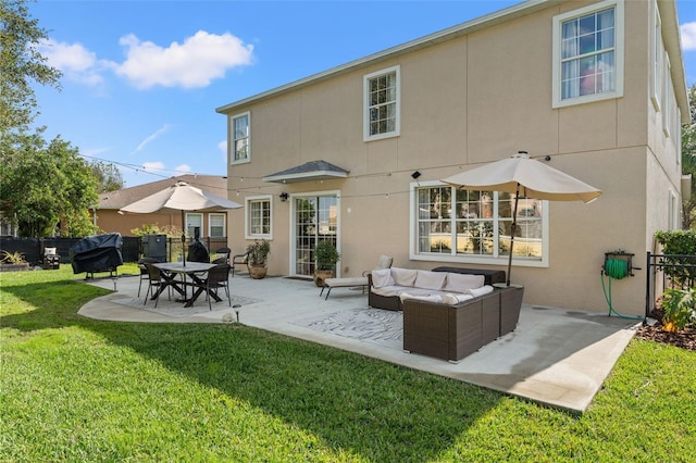 back of property featuring an outdoor living space, a patio, and a lawn