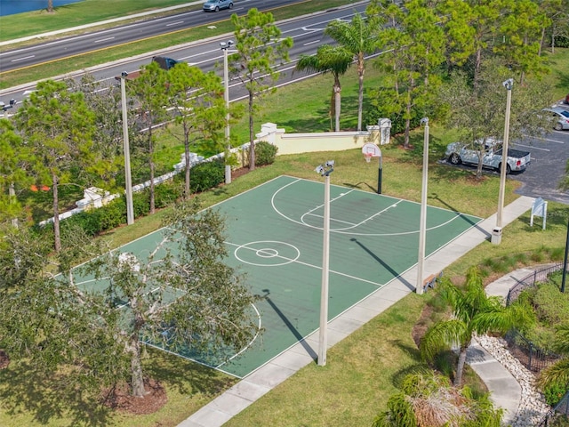 view of basketball court featuring a yard