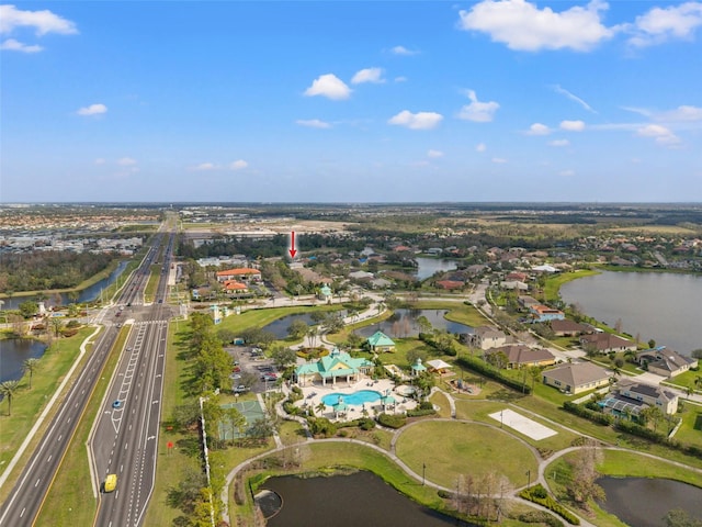 birds eye view of property featuring a water view