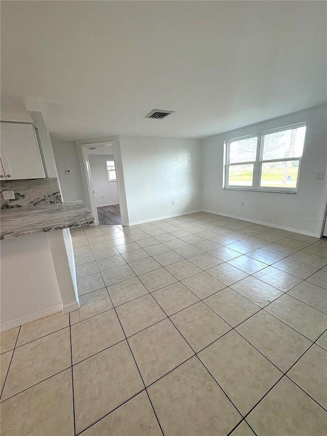 interior space with light tile patterned floors