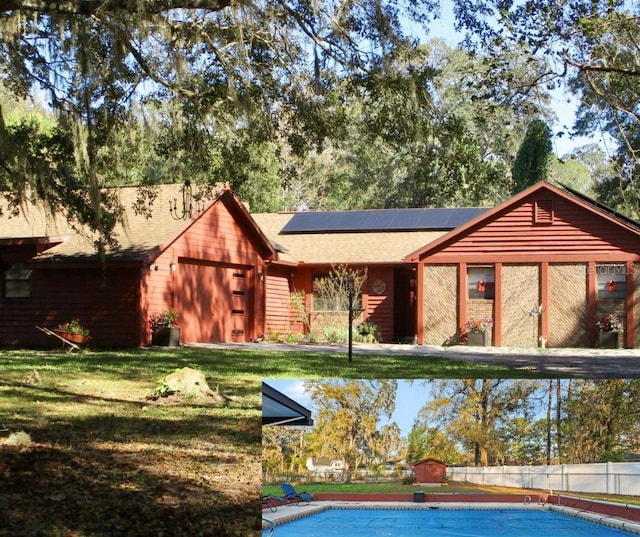 view of swimming pool with a yard and a fenced in pool