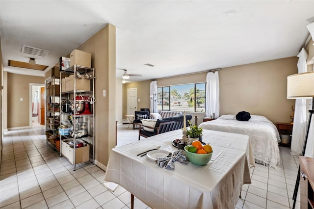 dining area with ceiling fan, light tile patterned flooring, visible vents, and baseboards