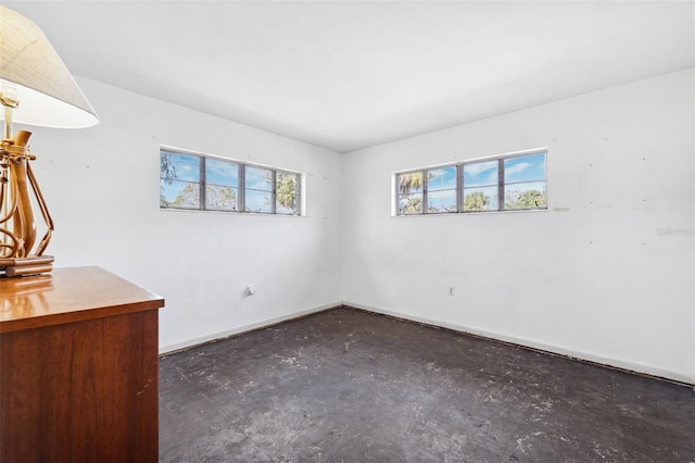 empty room with baseboards