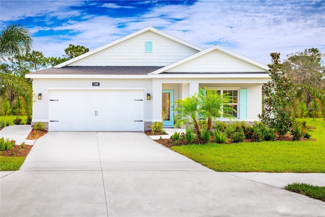 view of front of house with a garage and a front yard